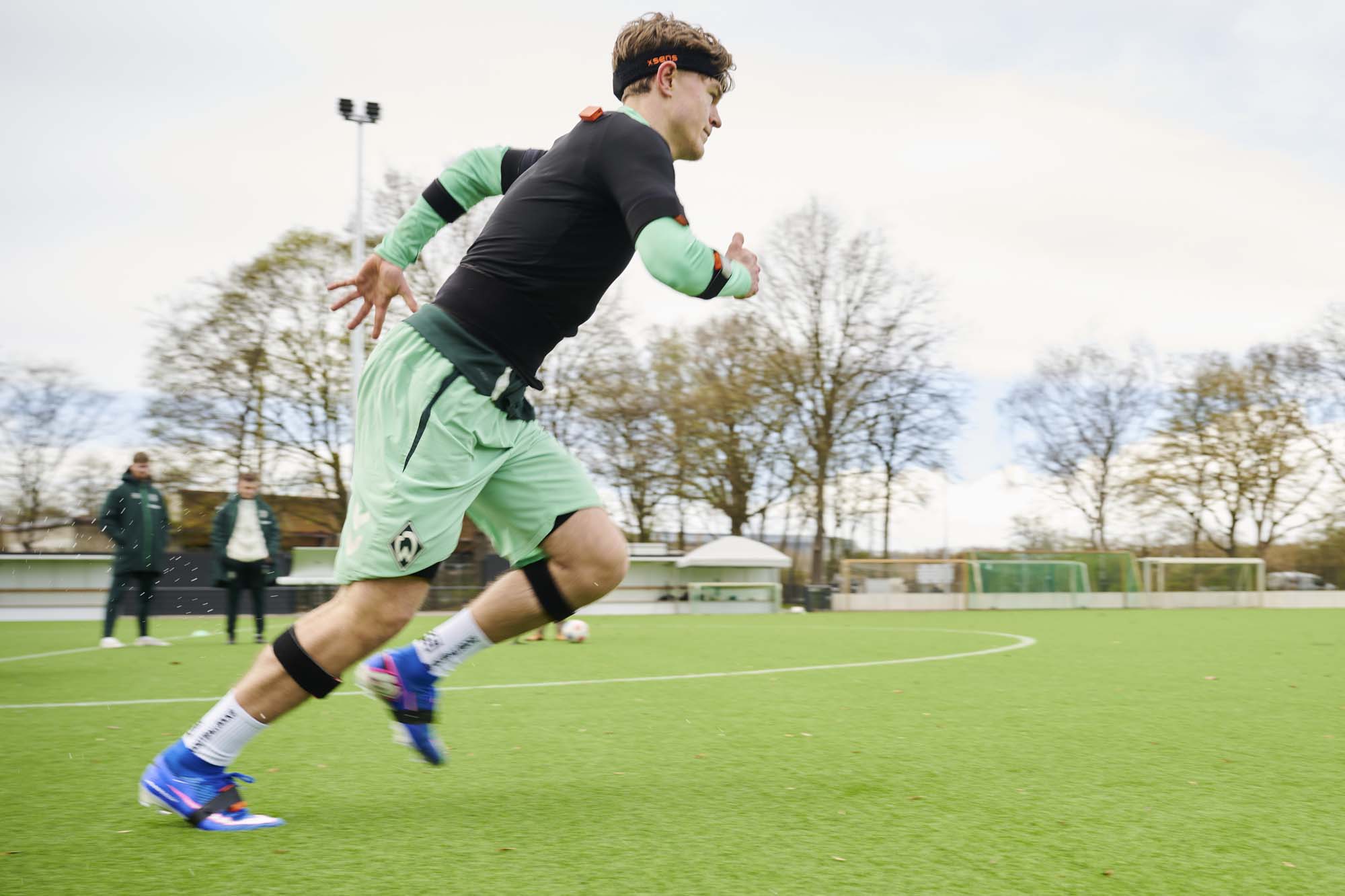 Male player doing running exercises with sensors for CTI